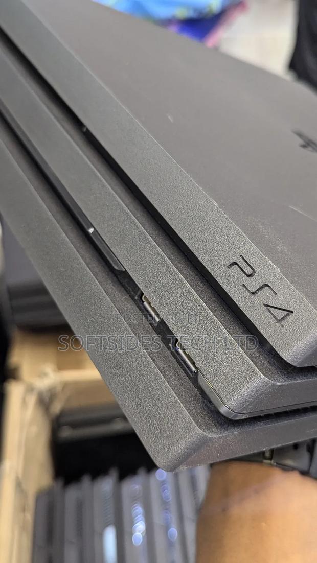 Clean Playstation 4 Pro Available With 17 Games And 2 Free Controllers · Photo 3