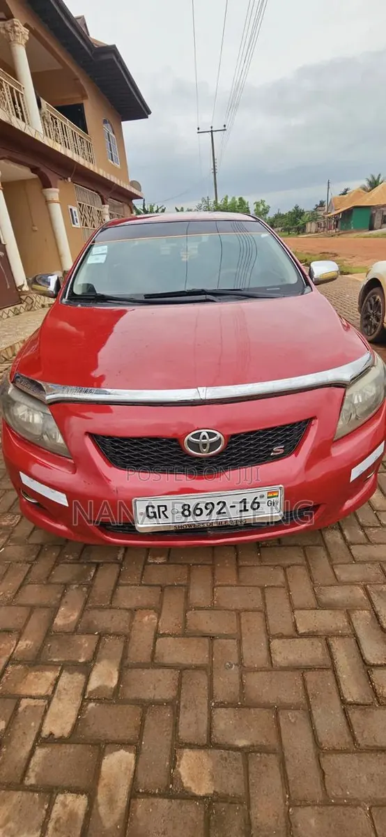Toyota Corolla 2010 Red · Photo 1