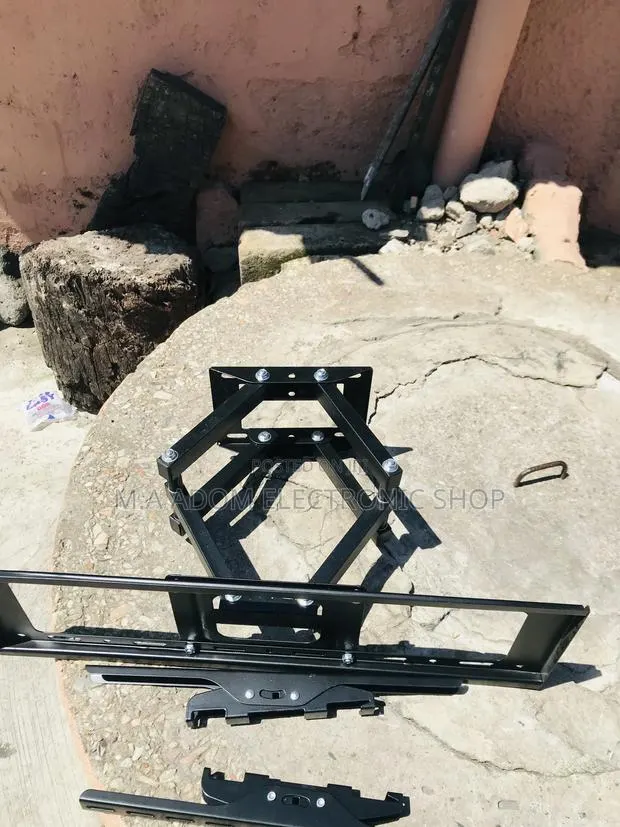 Unique in Box Adjustable Tv Bracket for 32 Inch to 80” Tv. · Photo 1