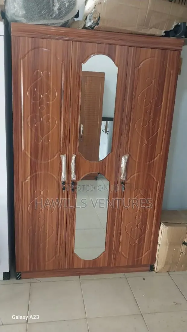 Brown Three-Door Wooden Wardrobe With Two Mirror · Photo 1