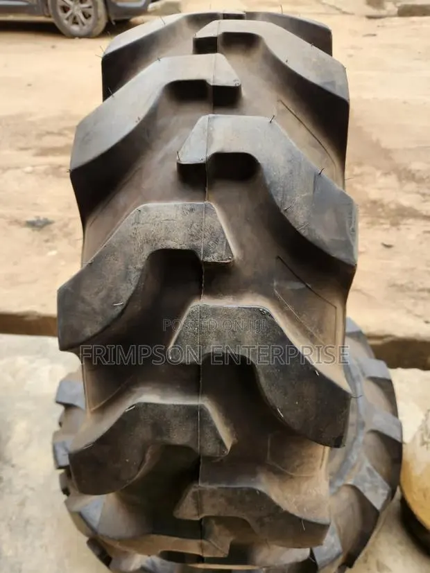 12.5/80-18 Backhole Tire And · Photo 1