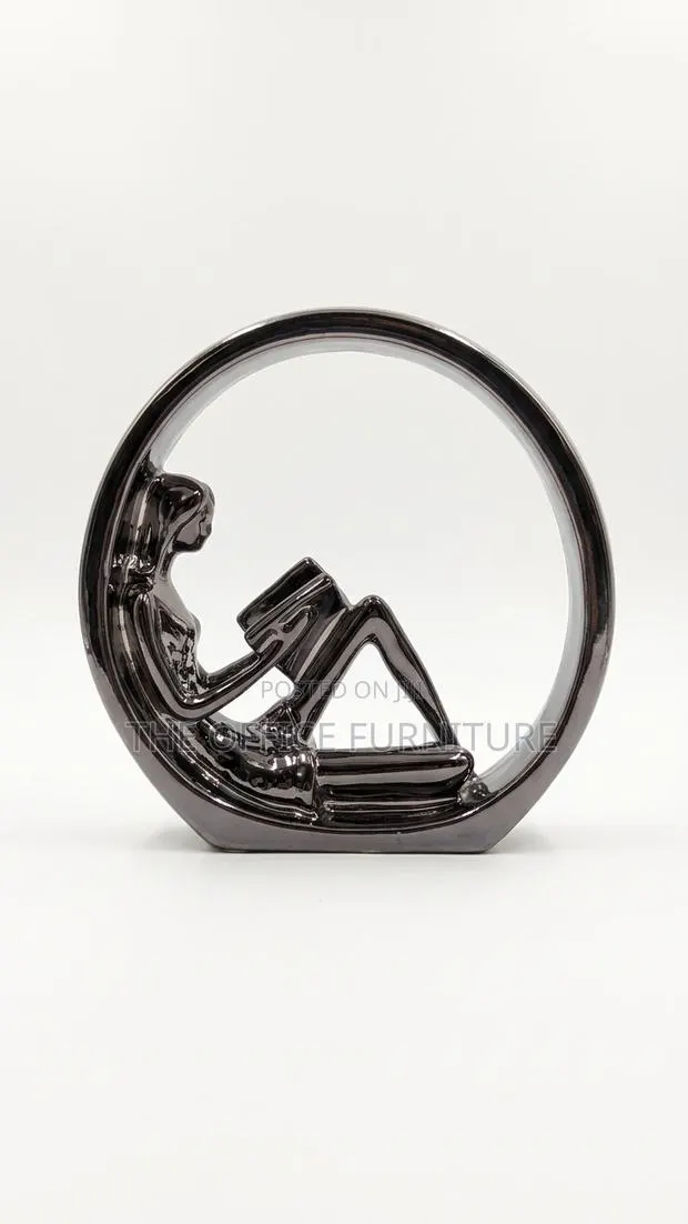 Modern Silver Reading Lady Sculpture · Photo 1