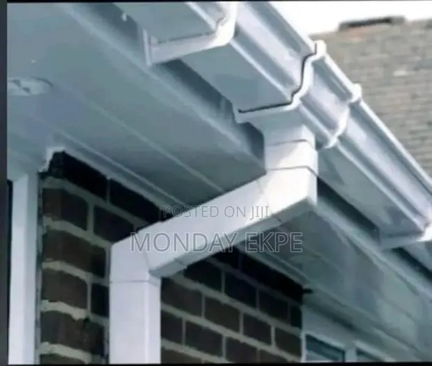 White PVC Rain Gutter and Black Accessories · Photo 1
