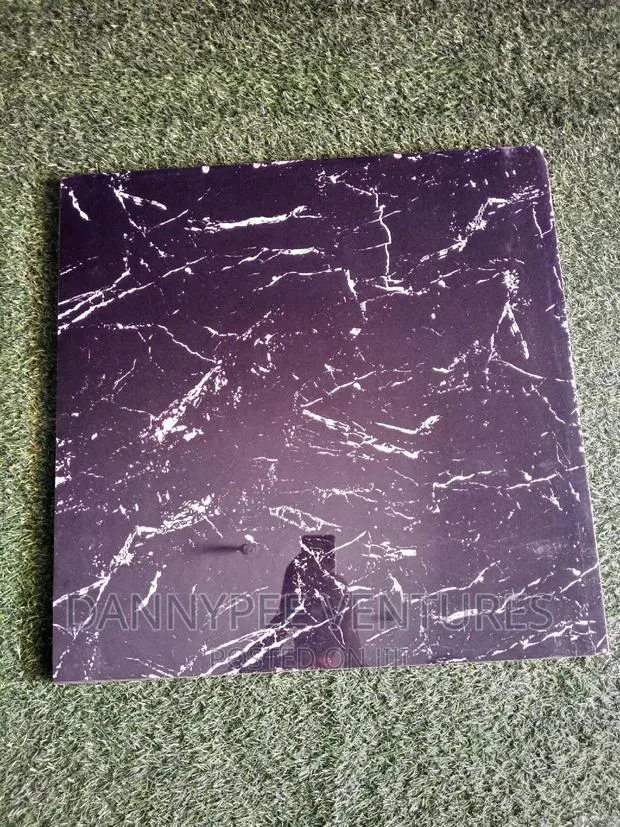 Black With White or Gold Polish Floor Tiles · Photo 1