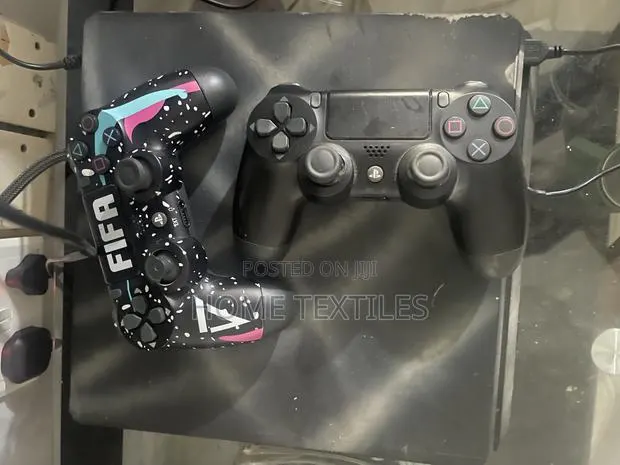 PS4 Slim With 2 Controllers and Games · Photo 1