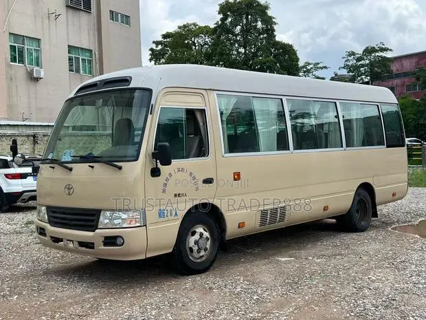 Toyota Coaster 2014 Beige · Photo 1