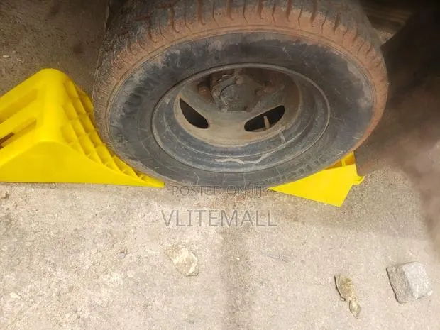Yellow Plastic Wheel Chock · Photo 1