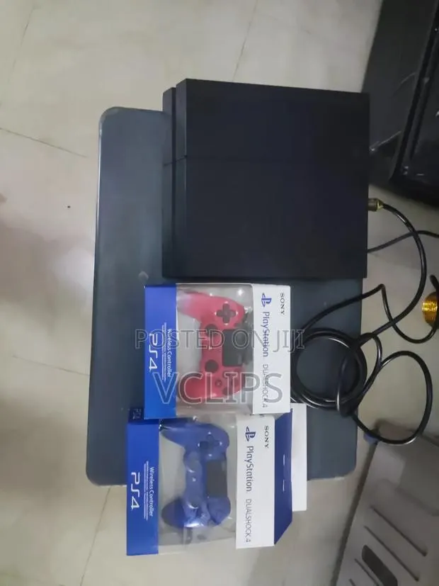 PS4 With Two Controllers and Games · Photo 1