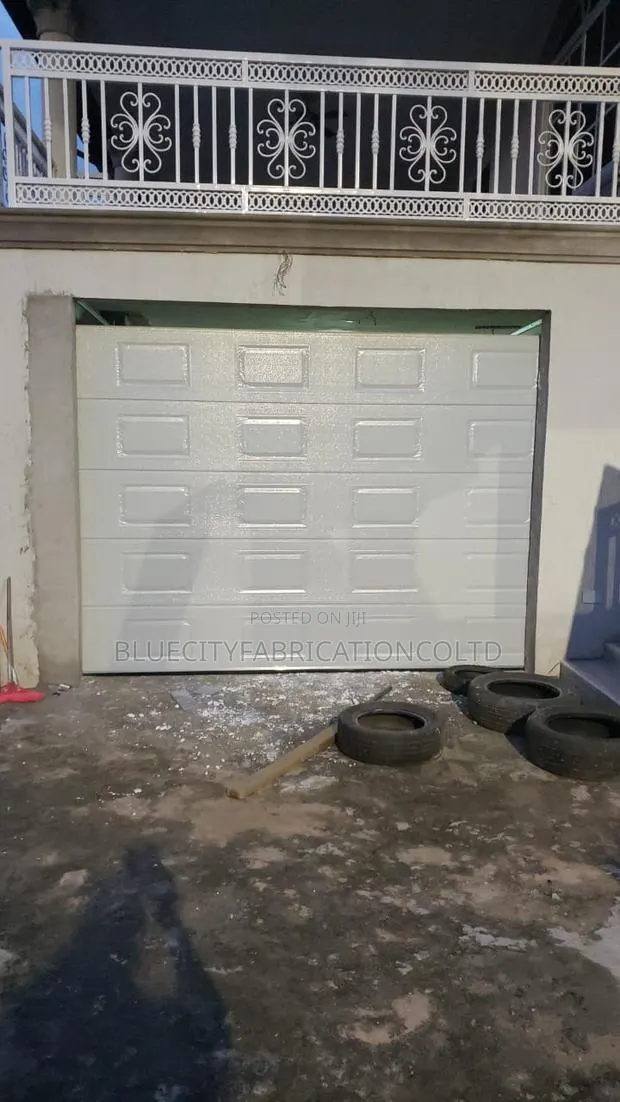 Black Coated Remote Control Garage Door · Photo 1