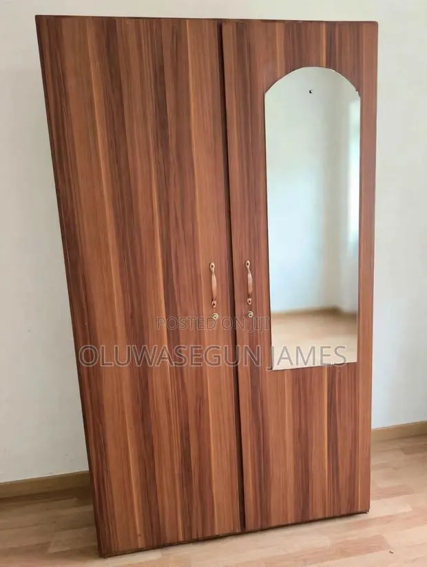 Neatly Used 2-Door Wooden Wardrobe With Mirror and Drawers - Takoradi · Photo 1
