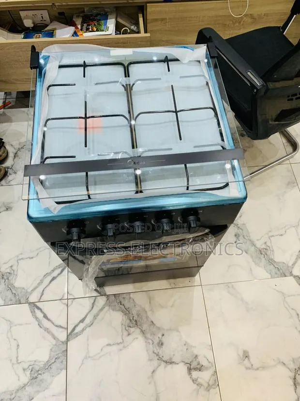 Grab the New Black Gas Cooker Oven 4burner Midea · Photo 1