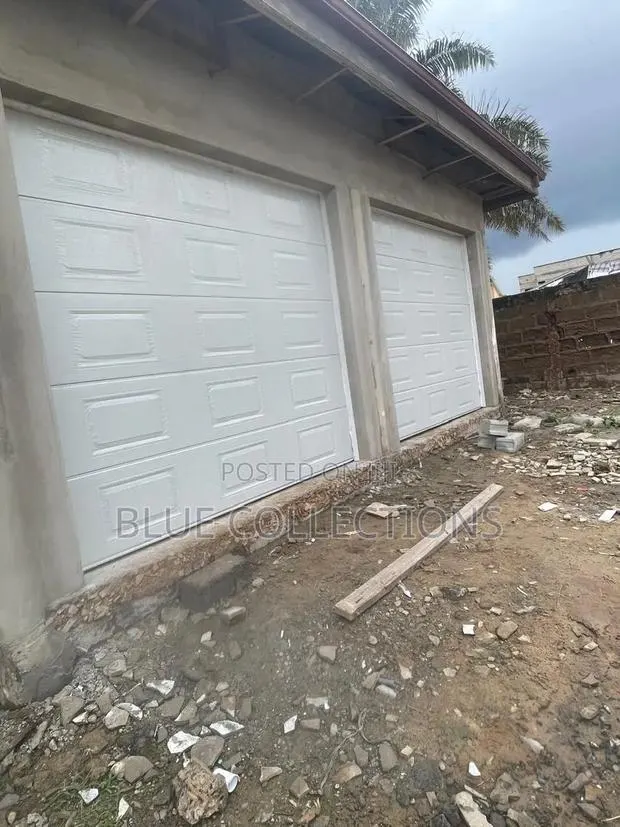 Double Panel Garage Door With Smart Motor · Photo 1