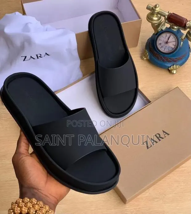 The Black Slide Sandals With a Wide Single Strap · Photo 1