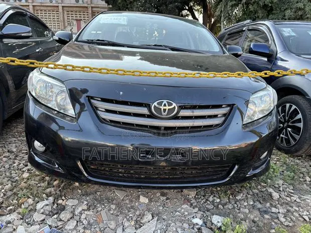 Toyota Corolla LE 4dr Sedan (1.8L 4cyl 4A) 2010 Black · Photo 1