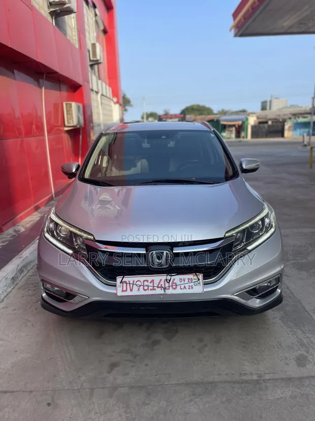 Honda CR-V Touring 4dr SUV AWD (2.4L 4cyl CVT) 2015 Silver · Photo 1