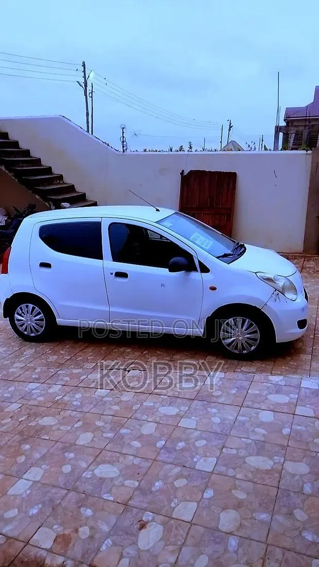 Suzuki Alto 1.0 2010 White · Photo 1