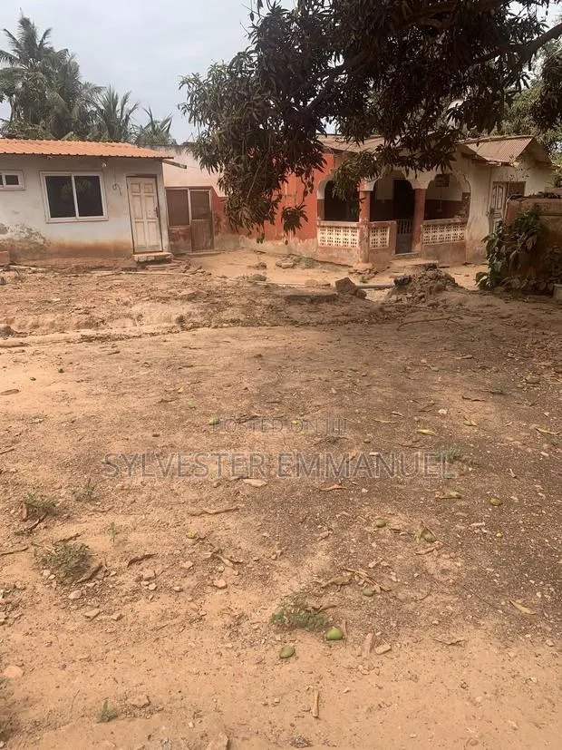 A Plot of Land (70/100 ) at Aplaku on a Roadside With a Building · Photo 1