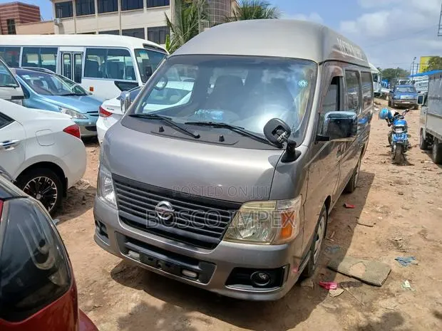 Nissan Caravan (Urvan) 2009 Brown · Photo 1