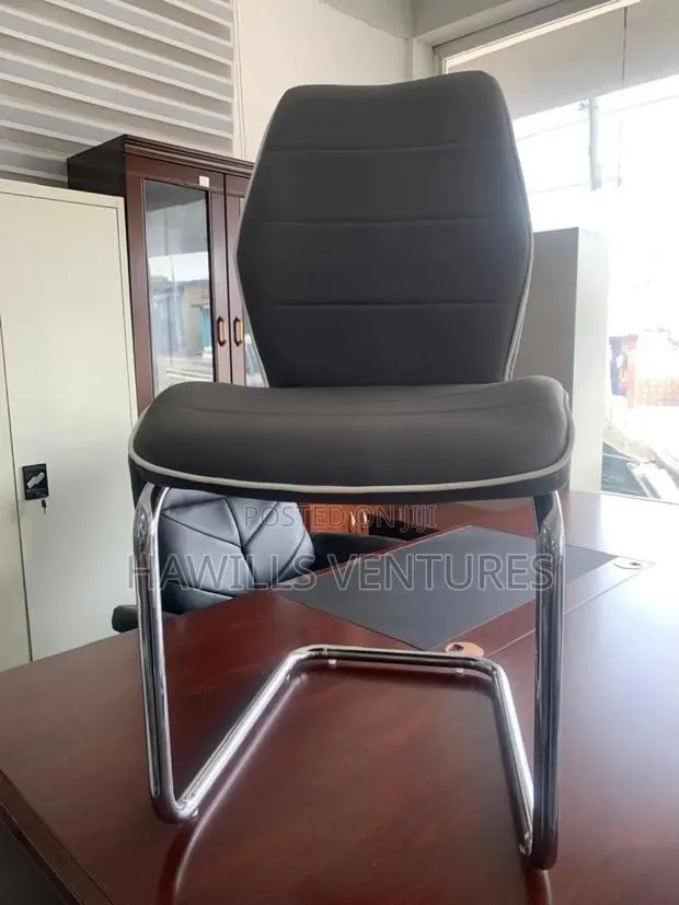 Gray Leather Dining Chair Featuring a C-Shape Chrome Metal. · Photo 1