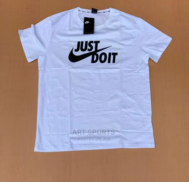 Nike Tops . · Photo 1