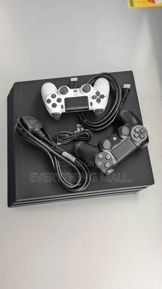 Sony PlayStation 4 Standard Console Loaded With Games + 2 Controllers · Photo 1