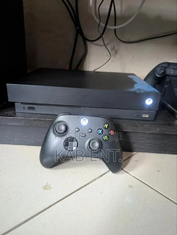 Xbox One X Console With Games and One Controller · Photo 2