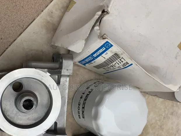 Mazda CX-7 Oil Filter and Filter Base Mount · Photo 1