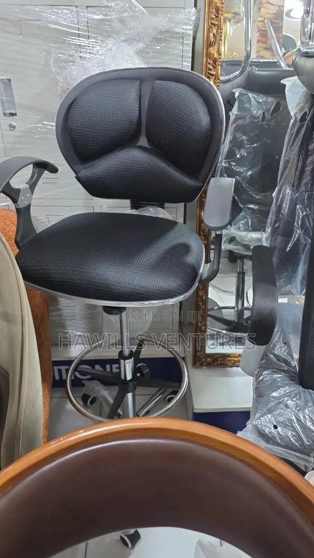 Counter Chair Features a Swivel Base. · Photo 1