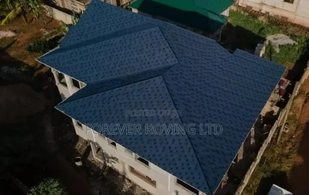 New Zealand Blue Shingles Roofing Tiles Installation. · Photo 1