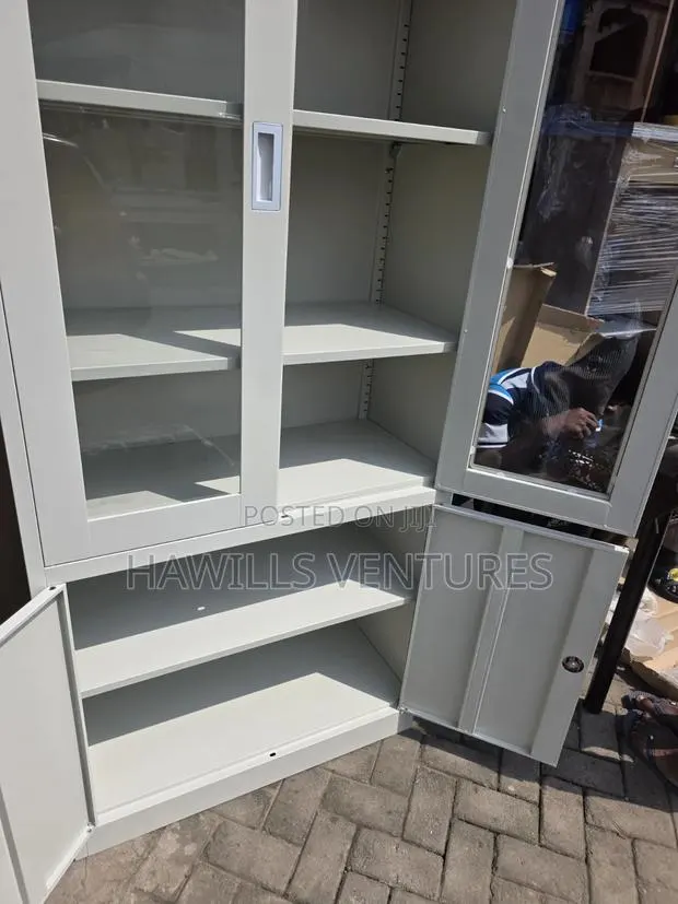 Metal Filing Cabinet, Top Glass Doors and Lock Bottom Compartment. · Photo 1