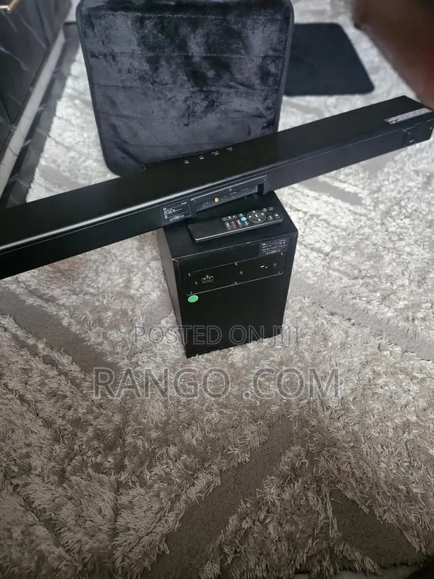 Affordable and Clean LG Soundbar With Deep Bass Subwoofer Plus Remote · Photo 1
