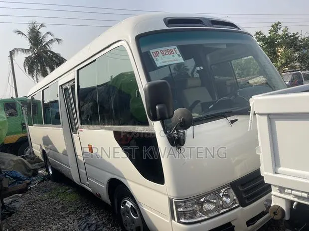 Toyota Coaster 2012 White · Photo 1
