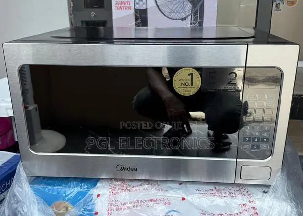 Midea 62L Electronic Touch Control Solo Microwave Oven EM262AMY-S · Photo 1
