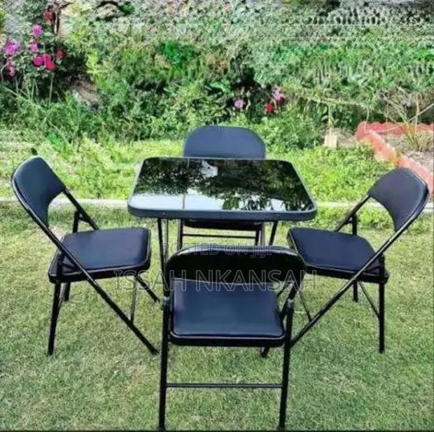 Foldable Glass Table and 4 Chairs · Photo 1