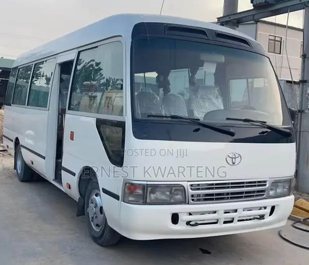 Toyota Coaster 2014 White · Photo 1