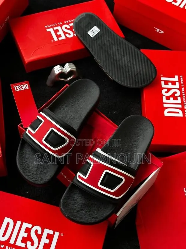 The Diesel Sa-Mayemi D Slides in Black, Featuring a Striking · Photo 1