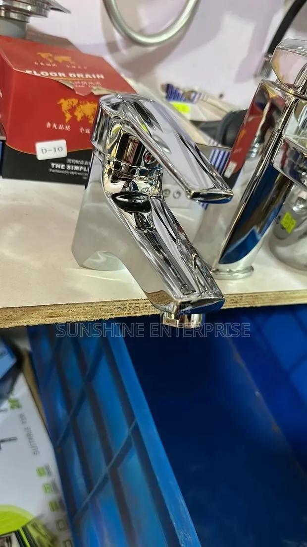 Stainless Lifting Wash Hand Basin Tap · Photo 1