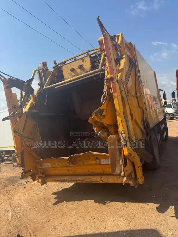 Rear-Loading Garbage Compactor Truck · Photo 1