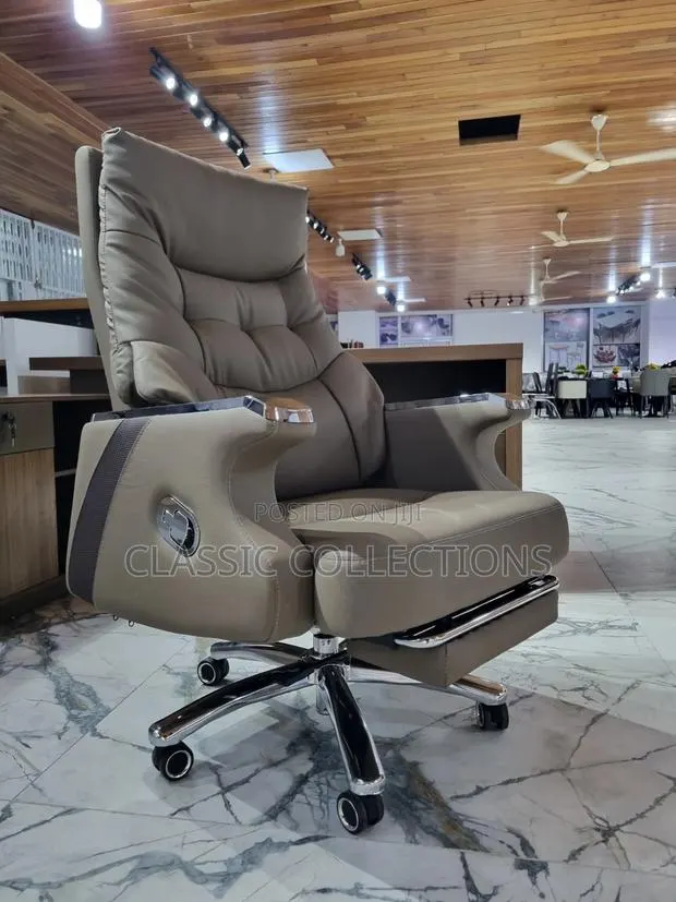 High-Back Executive Boss Chair With Retractable Footrest · Photo 1