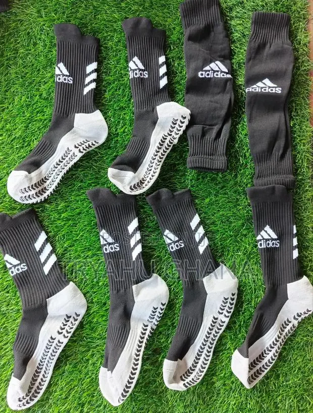 Authentic Adidas Football Players' Socks And Holes · Photo 1