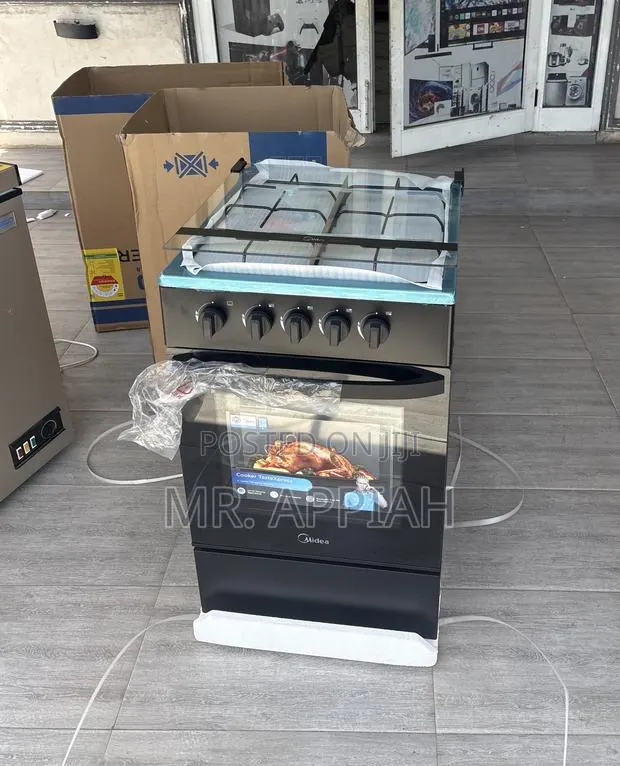 Midea 4 Gas Burner With Oven and Grill(Black)Glass Lid · Photo 1