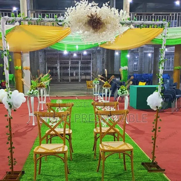 Walkway Stands, Metal Frame Arches, Cross-Back Chairs for Rent · Photo 1
