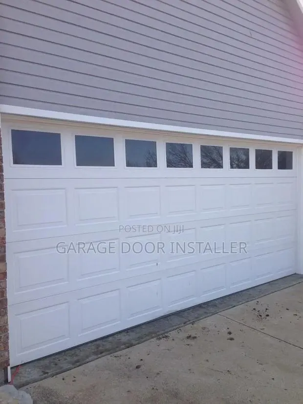 Garage Doors With Smart Motor and Fanlight · Photo 1
