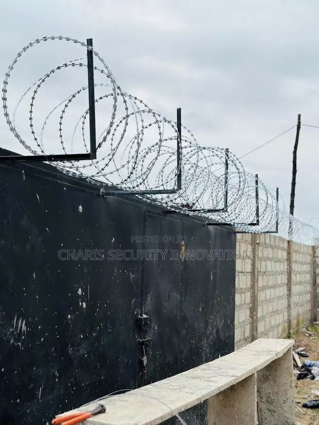 Professional Razor Wire Fence Installations With Warranty · Photo 1