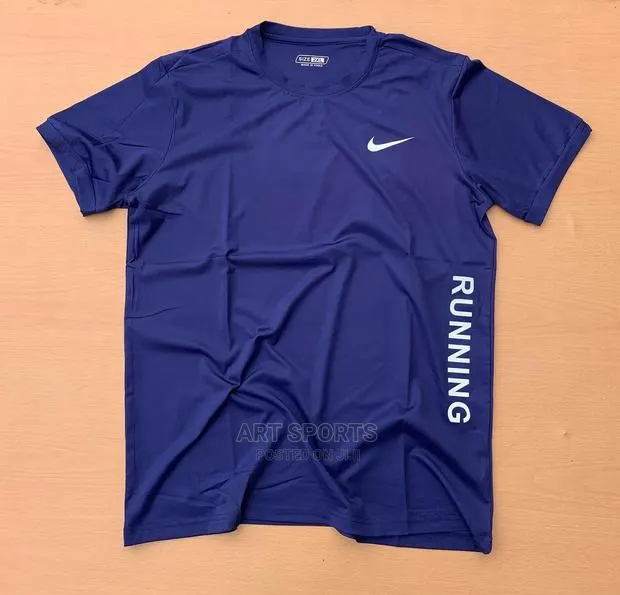 Nike Tops. · Photo 1