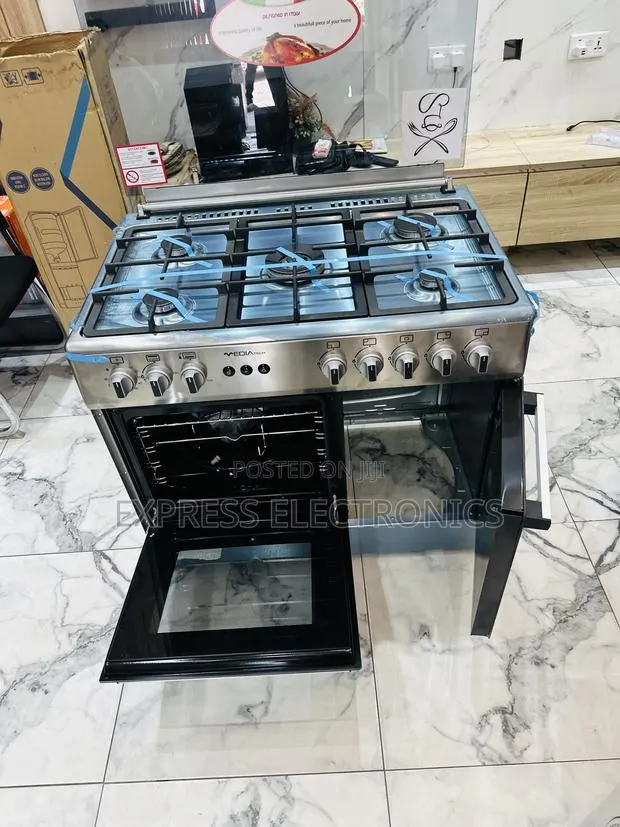 Ultra Modern Sleek Gas Cooker Oven Rotisserie Midea Tech Sliver 5b Gas · Photo 1