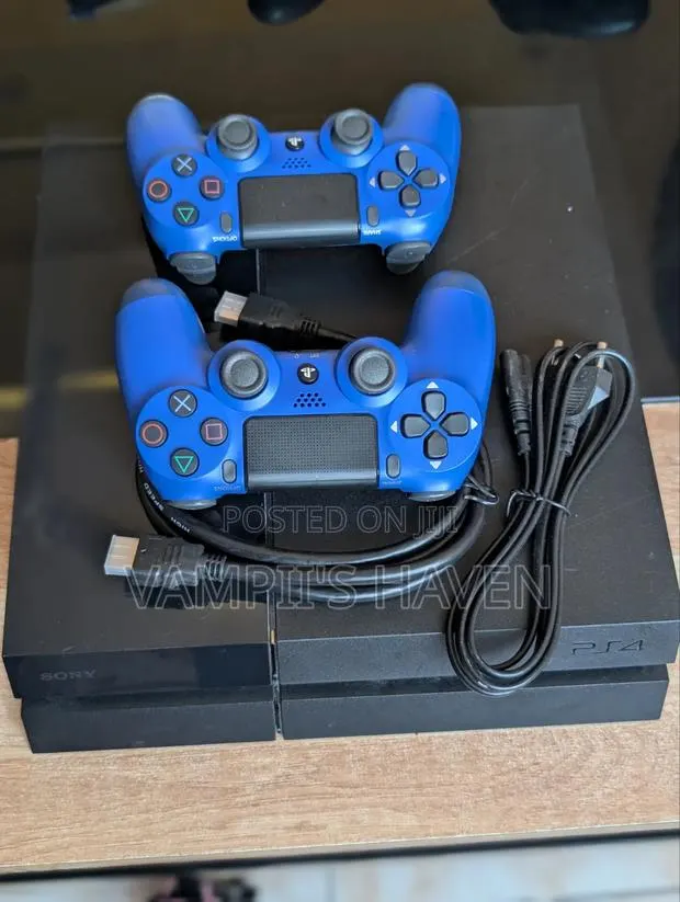 PS4 With 2 Controllers 8 Games HDMI Cable and Controller Charger · Photo 1