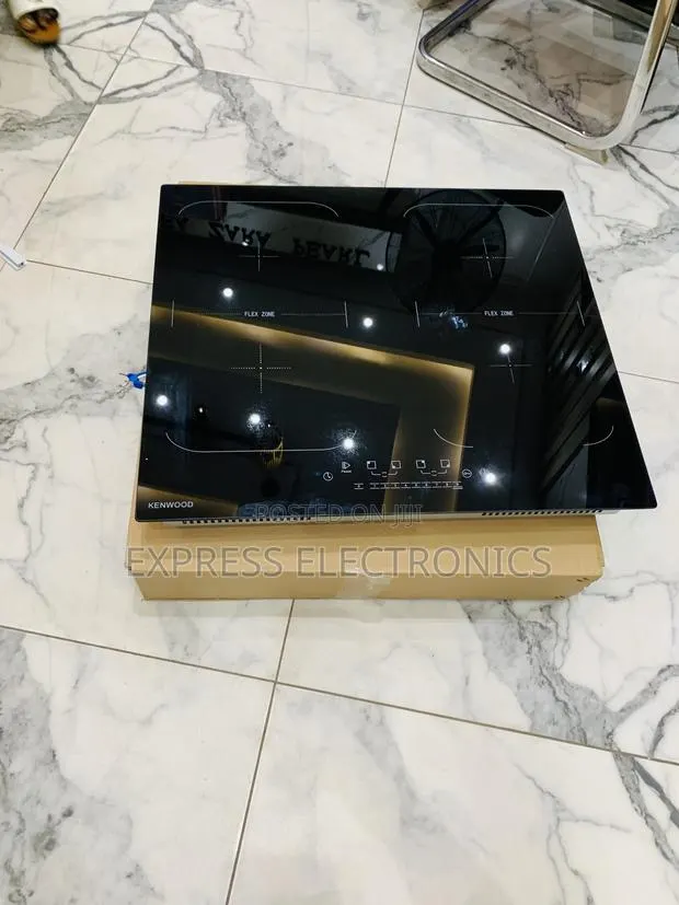 Ultra Modern Sleek Kenwood Electric 4 Burner Built In · Photo 1