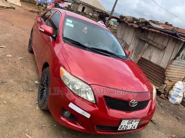 Toyota Corolla 2010 Red · Photo 1
