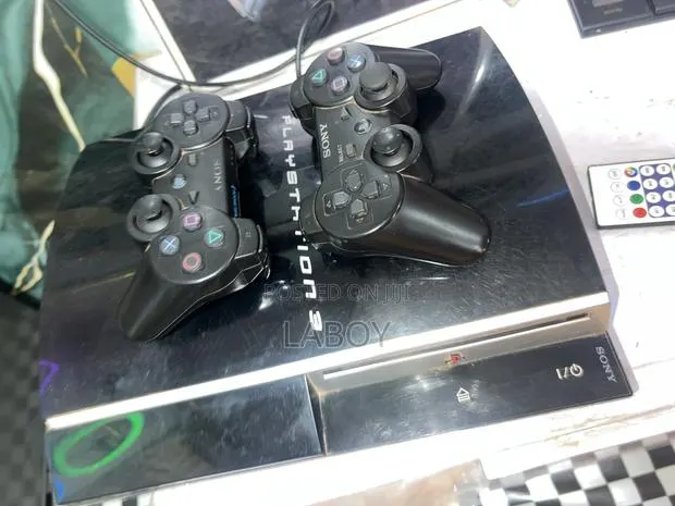 PS3 Standard With Two Controllers and 5games · Photo 1
